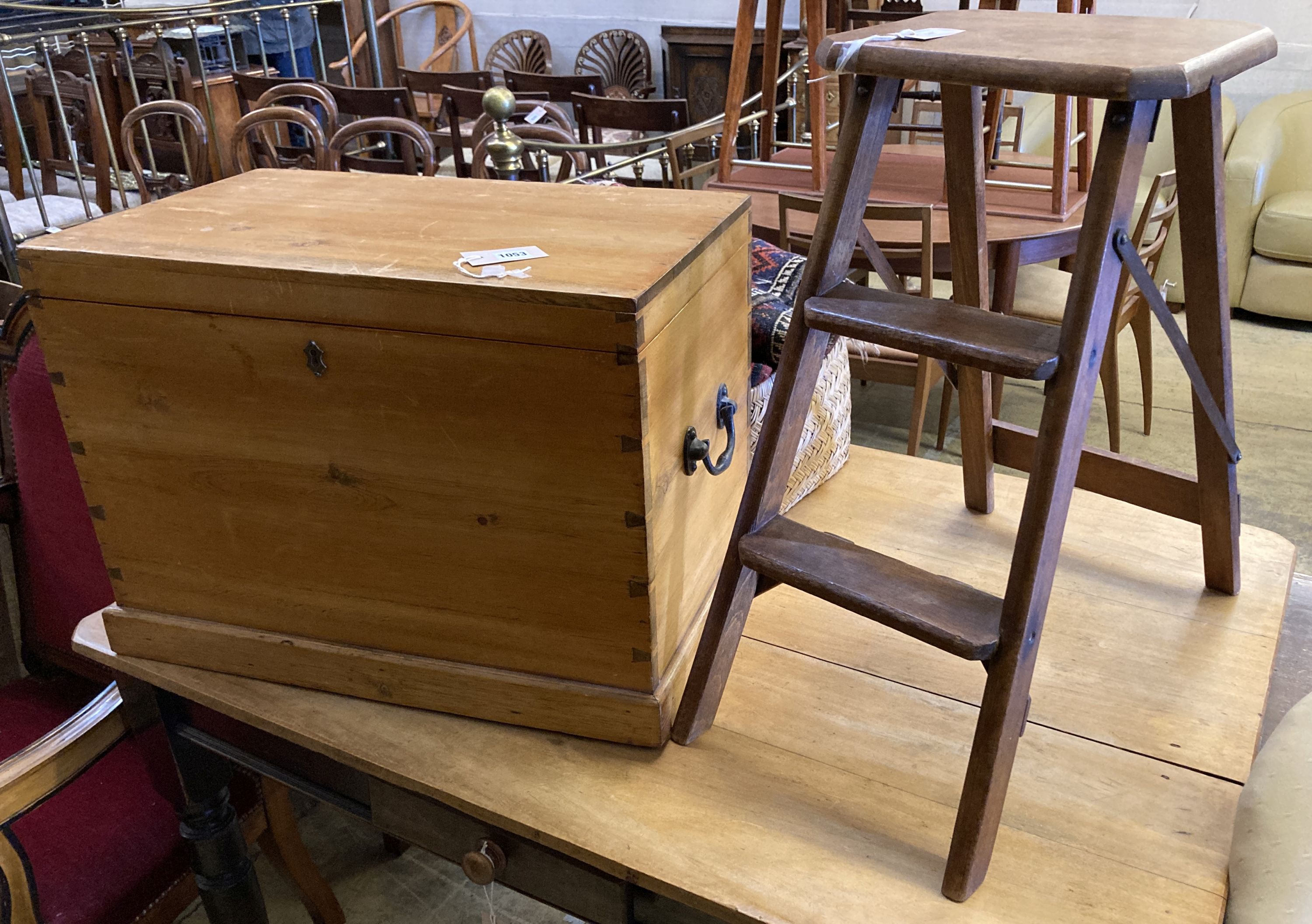 A pine chest with hinged top, width 63cm, depth 40cm, height 44cm together with a folding two-step stool